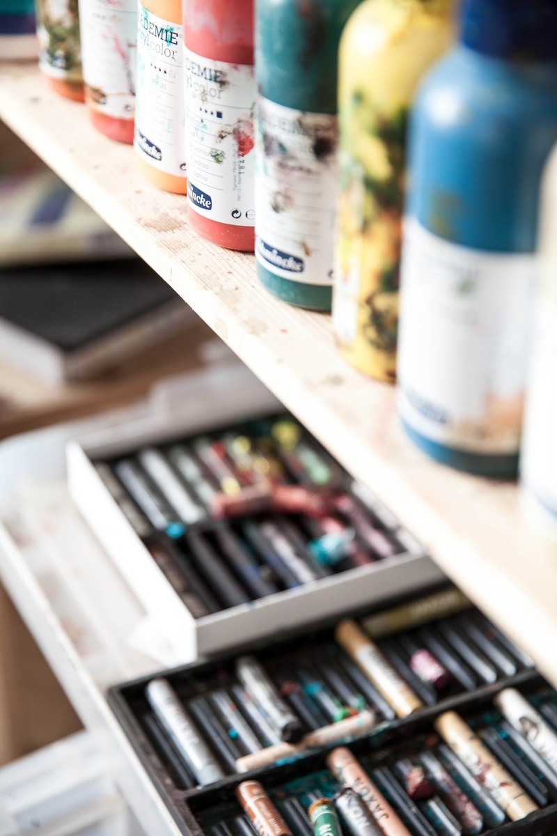 close up of paint oil pastel and drawers containing art supplies, blurred art supplies 4k