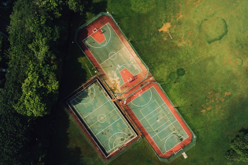 a drone shot of three sports fields in a park, three sports fields 4k
