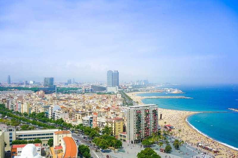 beautiful cityscape summer view of high rise around beach in barcelona just around the blue ocean, cityscape of barcelona city beach 4k