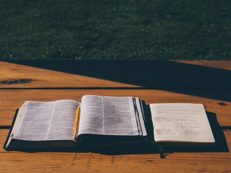 study bible book and pencil 4k