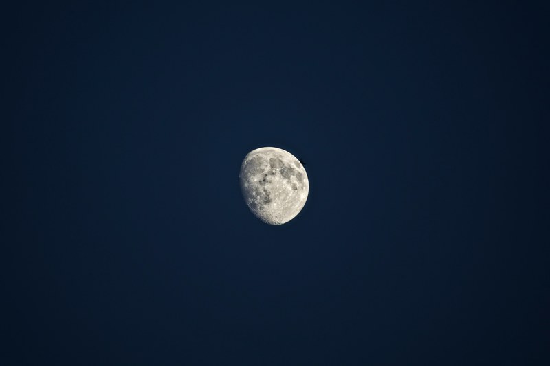 the moon on the blue sky on a lunar eclipse, eclipsed moon on the night sky 4k