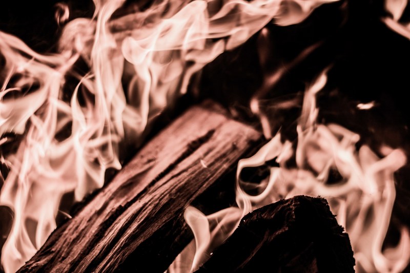 close up of firewood burning bright in a bonfire, campfire stories 4k