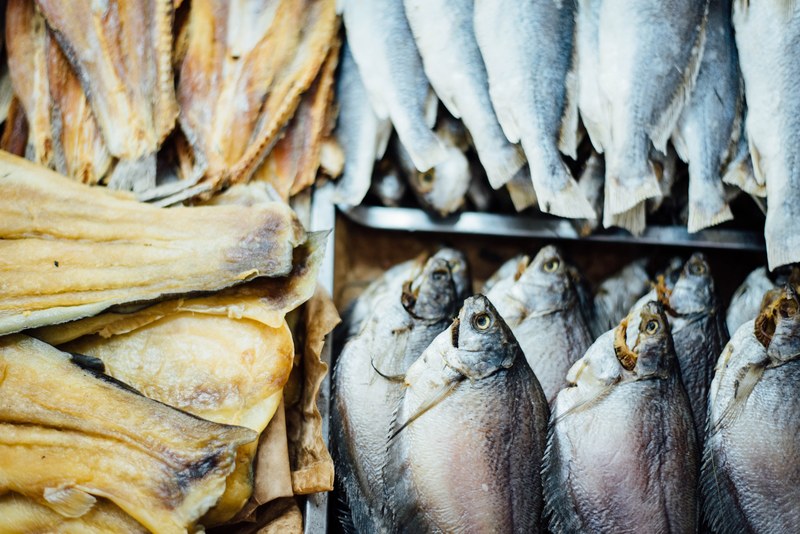 fresh fish neatly stacked in crates at a fish market, fish market 4k
