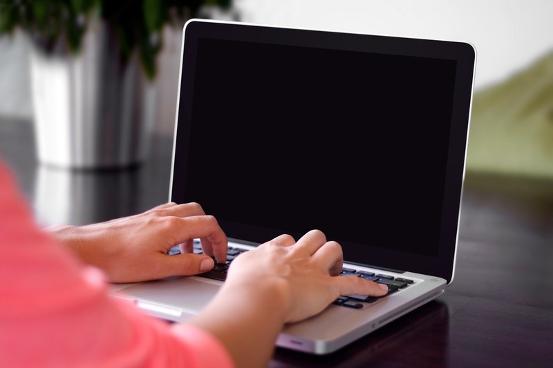 a persons hands typing on a laptop keyboard, typing on a laptop 4k