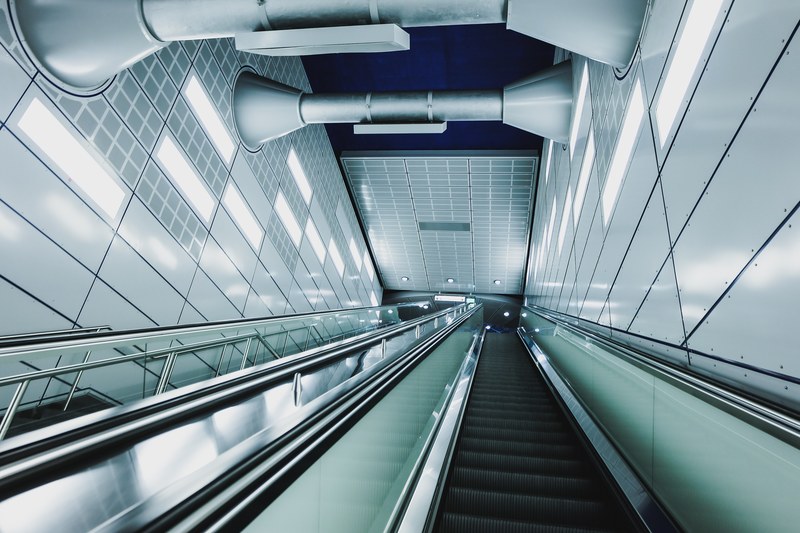 an empty staircase and an escalator at a subway station in cologne, subway staircase 4k