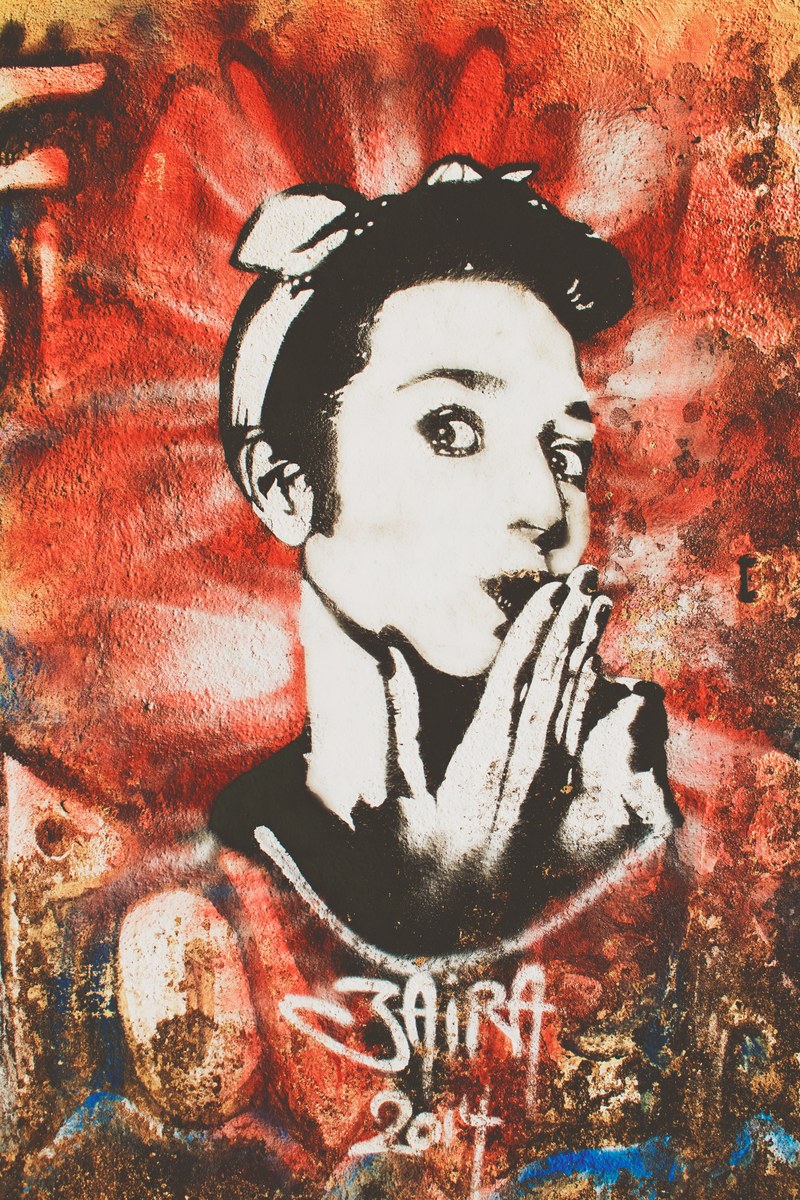 black and white graffiti artwork of woman blowing kiss on red indian institute of technology bombay, mural of vintage woman 4k