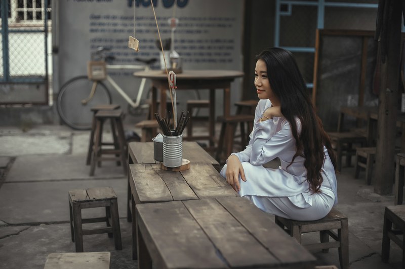 woman sitting table and stool 4k