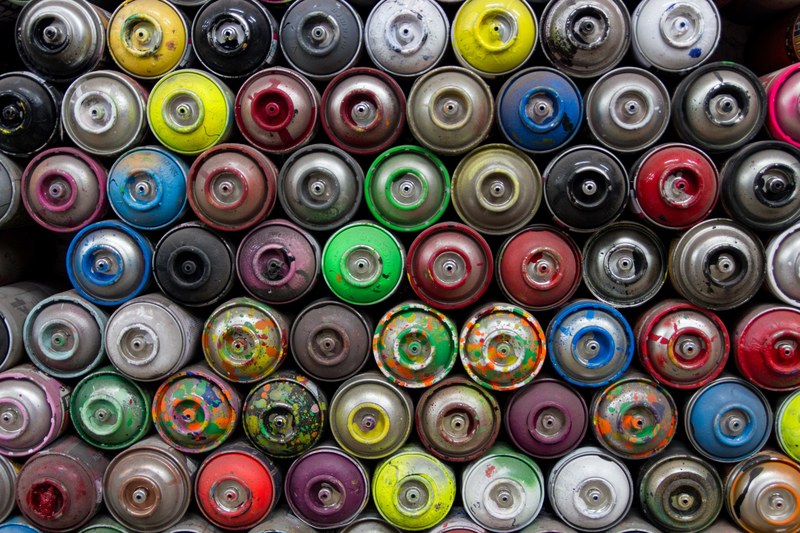 a colorful display of used spray paint cans in berlin, _spray paint cans berlin 4k
