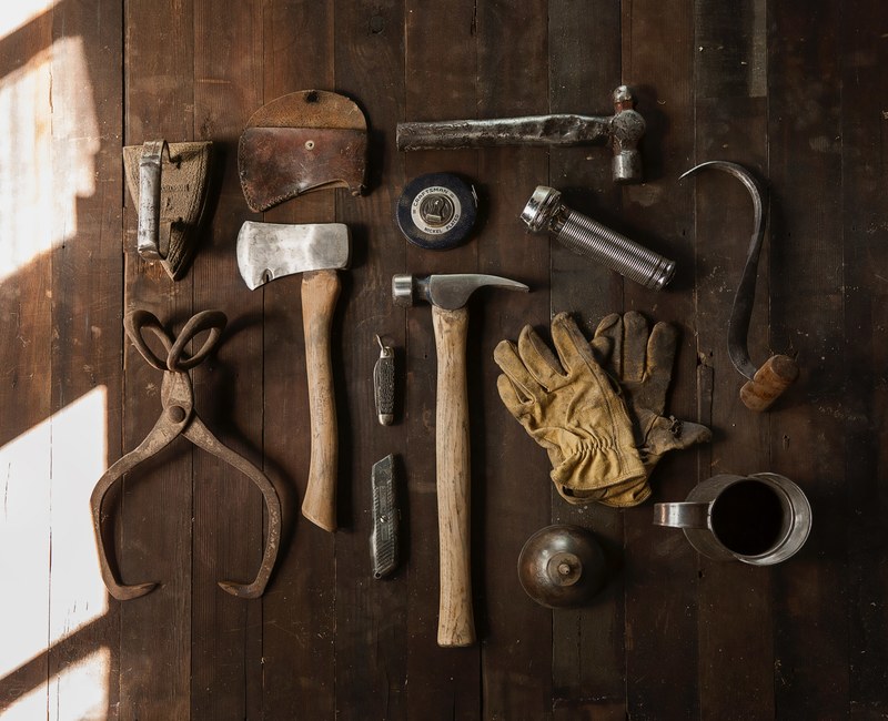 a displayed content of a toolkit displayed showing tools like hammer axe box cutter iron and flashlight, toolkit and tools 4k