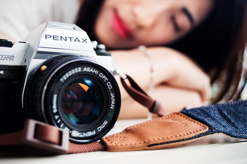 woman resting near pentax camera with strap, woman rests near camera 4k