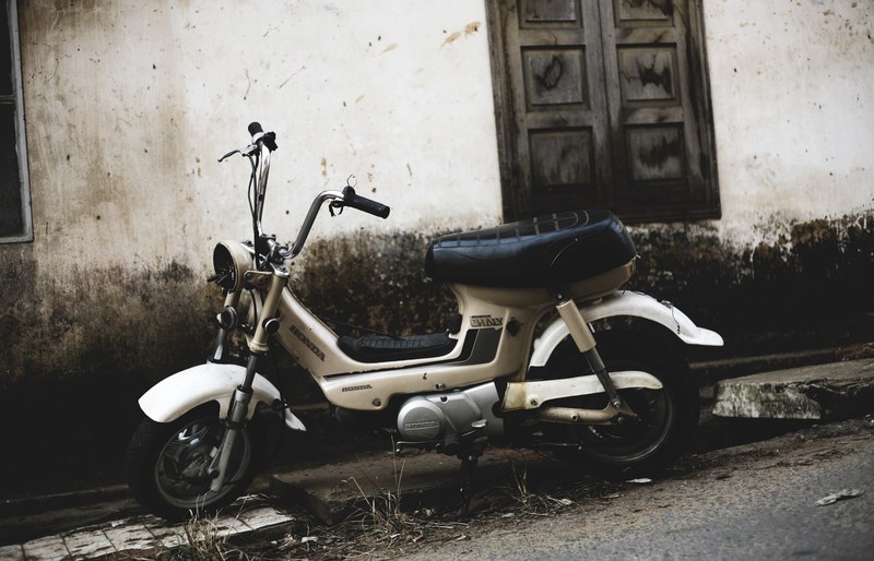 sepia photo of white moped on a street near wooden window, sepia moped on street 4k