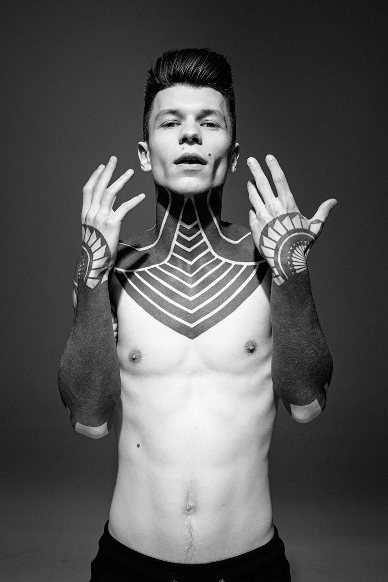 black and white shot of young man with sleeve and neck tattoos in kiev, jake davies 4k