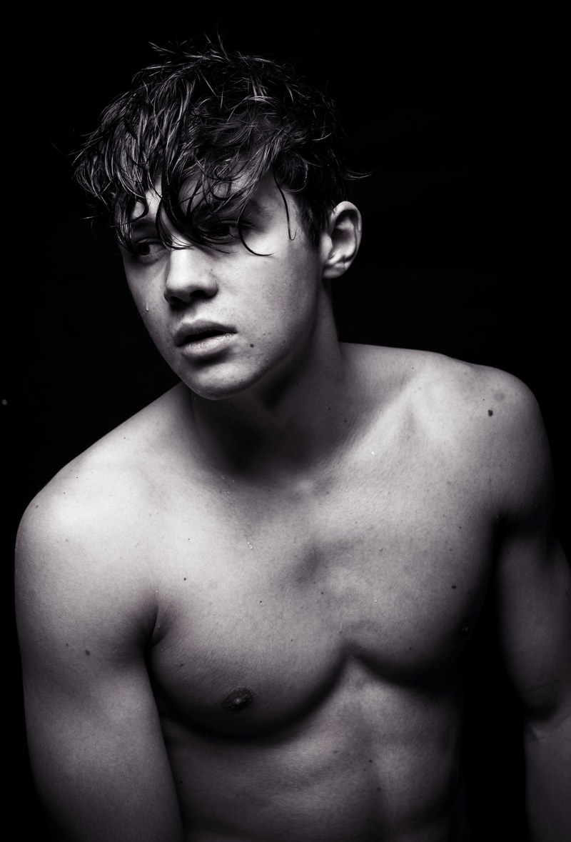 the portrait of a man wearing no shirt with his hair in his face, shades of emotions 4k