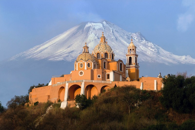 a church at the foot of a tall mountain in mexico, church at the mountains foot 4k