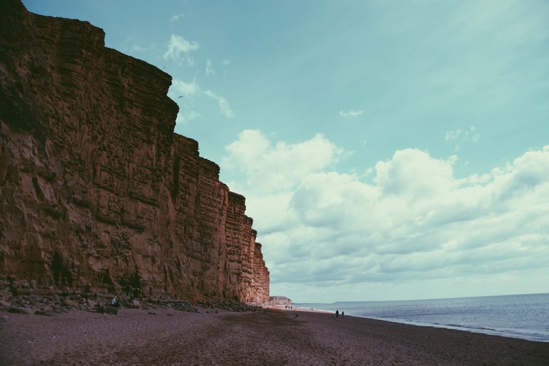 tall cliffs on the sandy beach coastline at west bexington pond, tall cliff coastline 4k