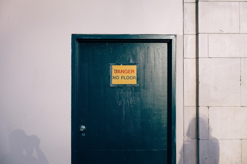 a black door with a yellow sign that reads danger no floor, _black door yellow sign 4k