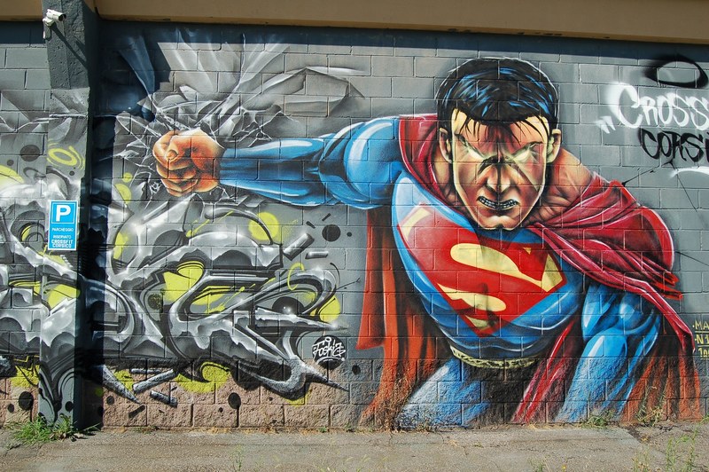 an intense graffiti painting of superman on a building wall, _cool superman graffiti 4k