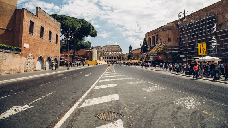 the coliseum in rome at the end of a street, rome coliseum 4k