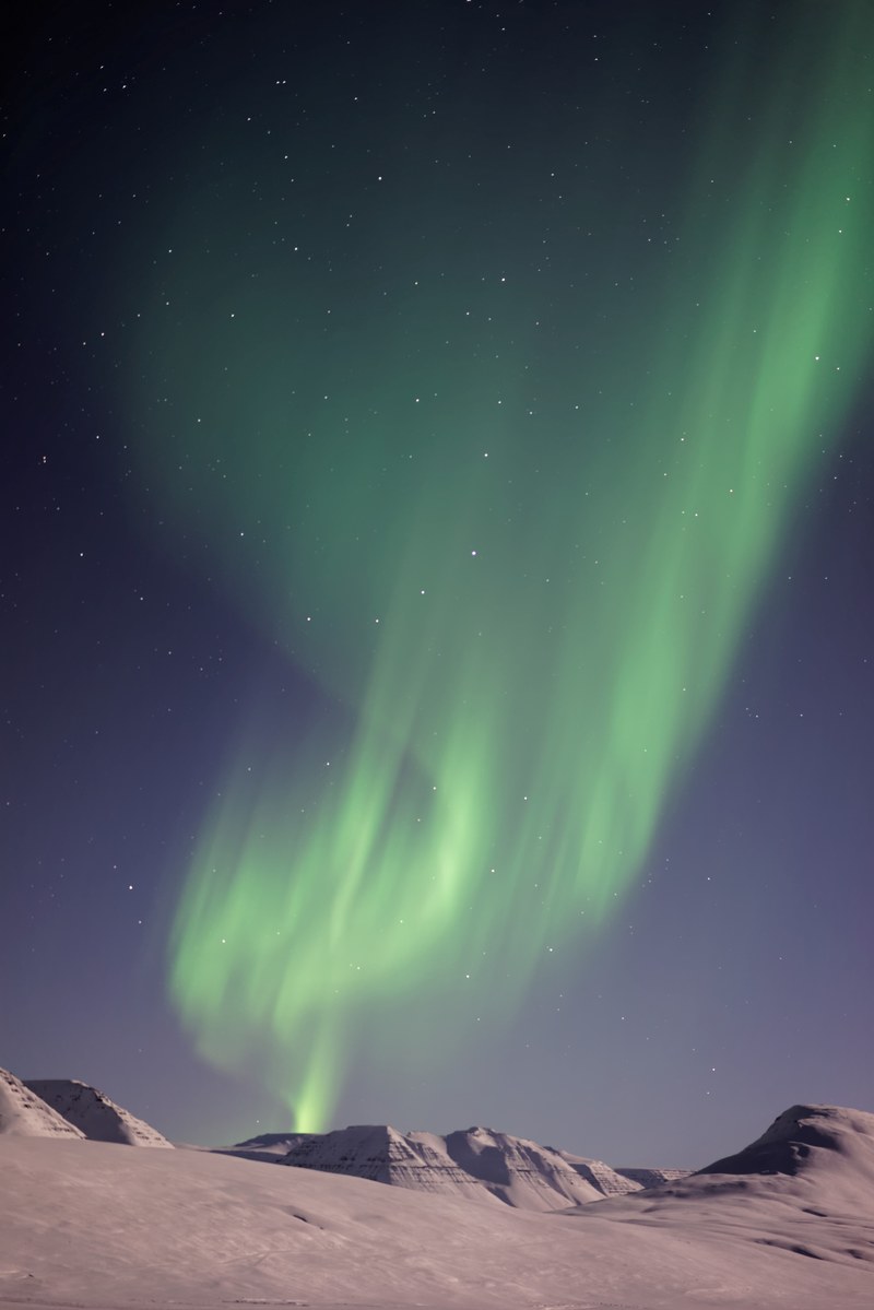 green northern lights above the hills in saurkrkur, northern lights saurkrkur 4k