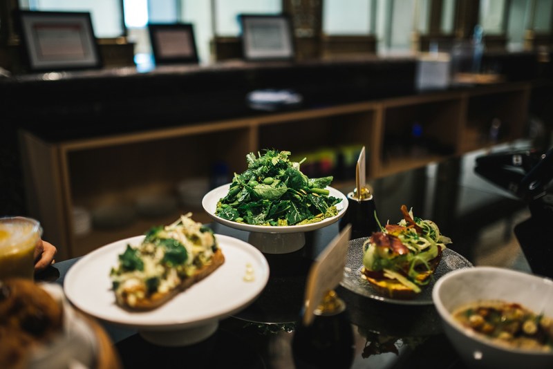 spinach salad and gourmet avocado toast at a health market, healthy cafe food 4k