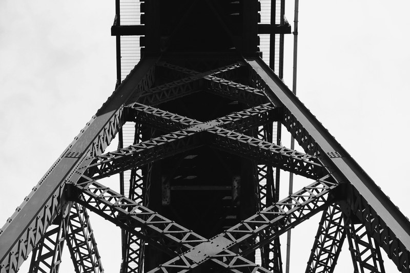 looking up at the bridge architecture made of steel beams, _metal structure from below 4k