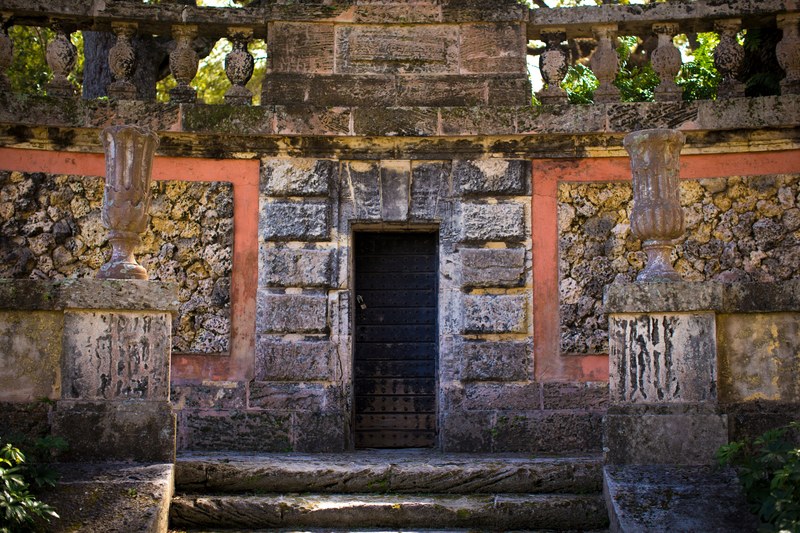 a locked door of an old block temple with steps beneath it, locked door of old temple_ 4k