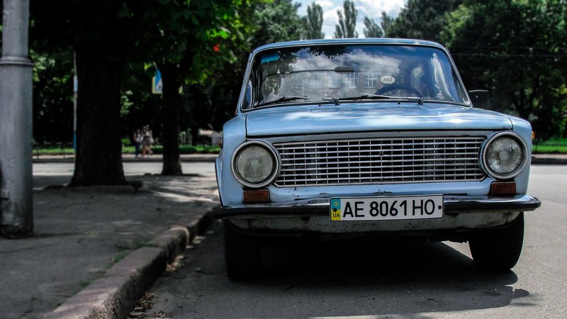 vintage pale blue car parked on pavement on sunny day in kryvyi rih, vintage car parked in kryvyi rih 4k