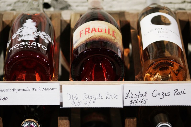 a collection of high class wine bottles in their packaging, collection of wine bottles 4k