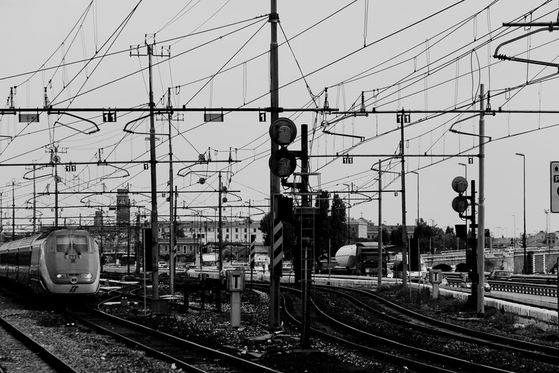 black and white shot of train overhead wires and railway infrastructure, monochrome rail scene 4k