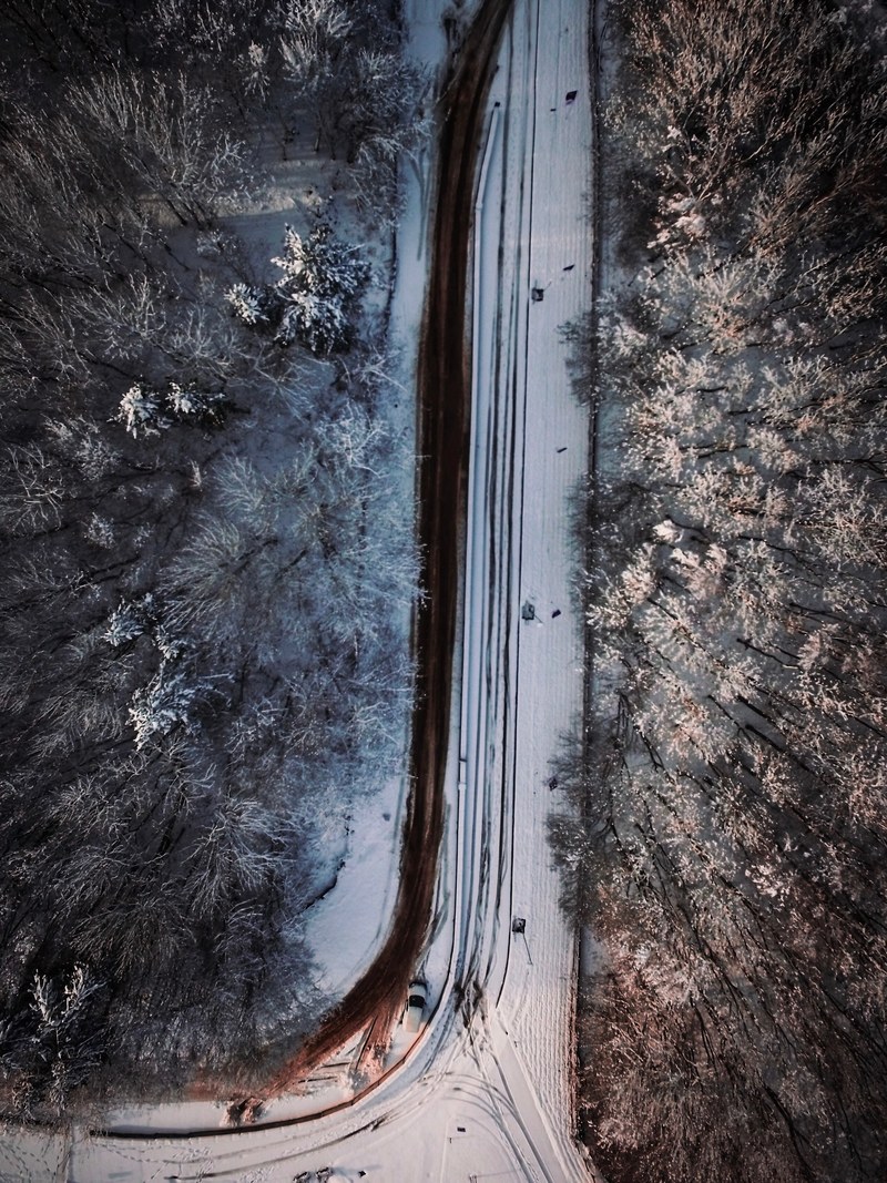 country road covered in snow 4k