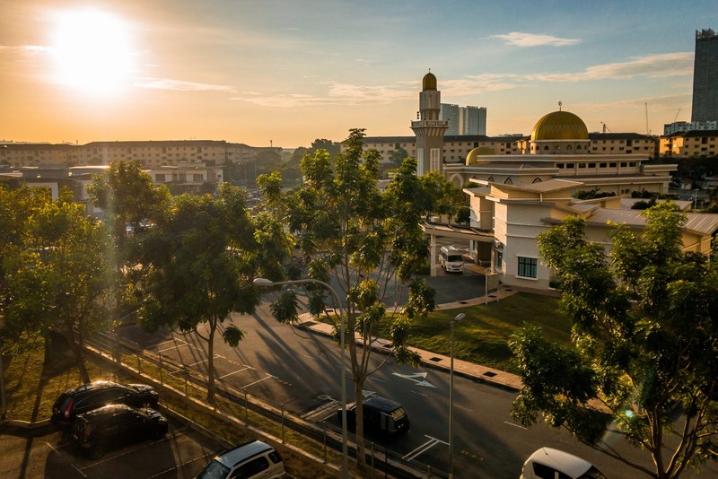 a dramatic view of a mosque during sunrise 4k
