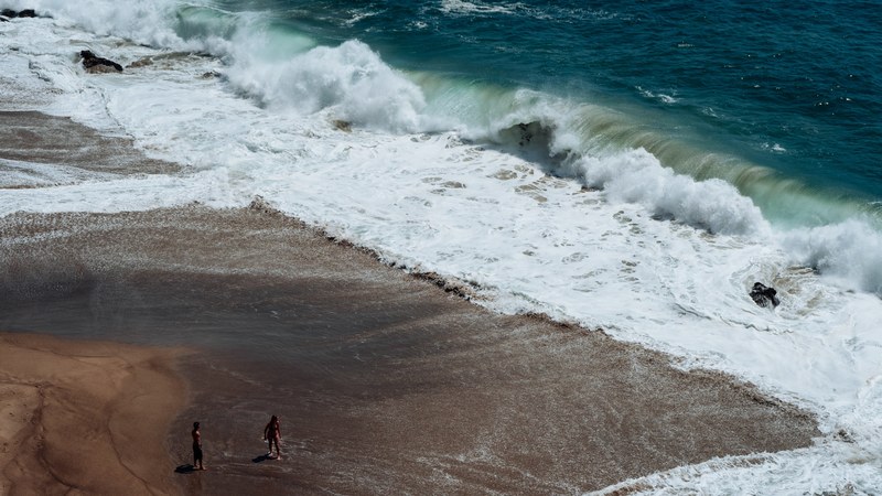waves crashing on the sand beach at point dume state beach, heading to the sea 4k