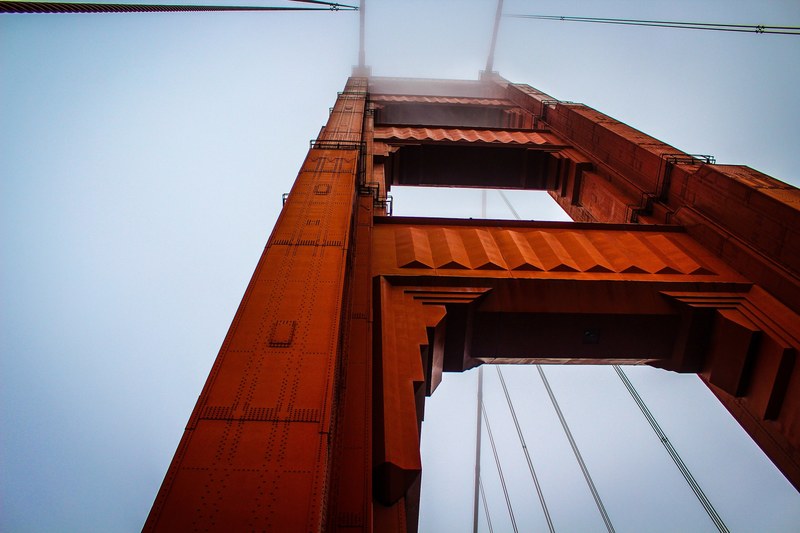 unique perspective of golden gate bridge on a foggy day, looking up at golden gate 4k
