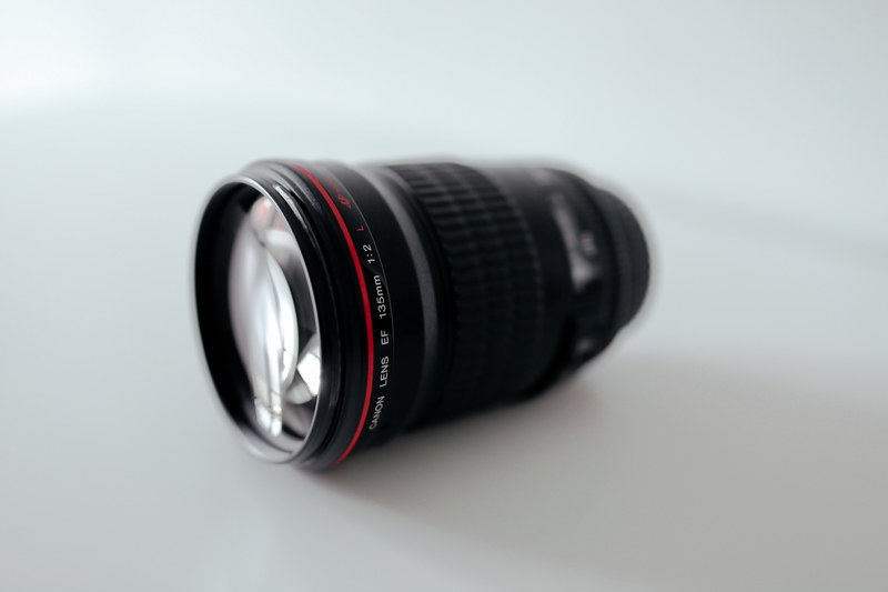 camera lens on a white table, photographers lens 4k