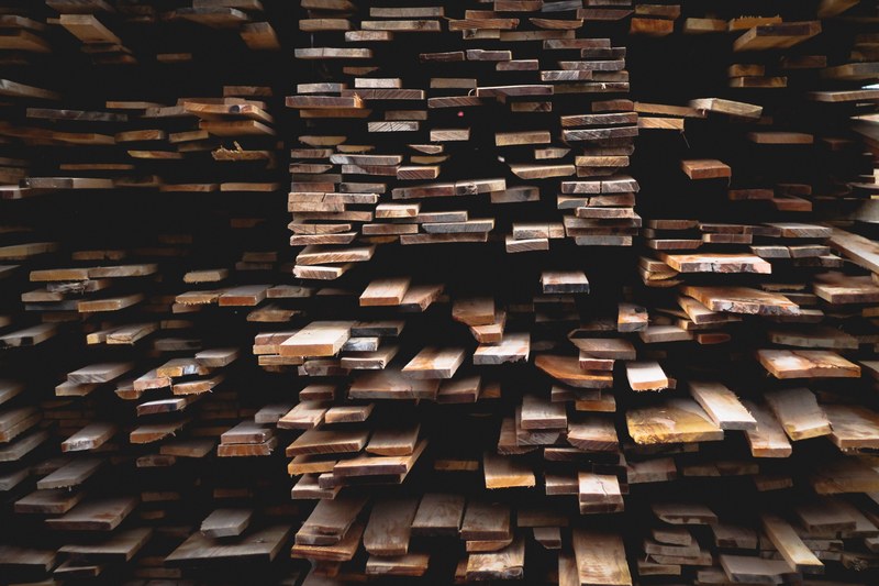 a pile of flat lumber wood stacked on each other, stacked wood planks 4k