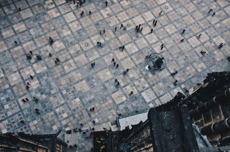 an overhead shot of a town square near st_ vitus cathedral, town square from above 4k