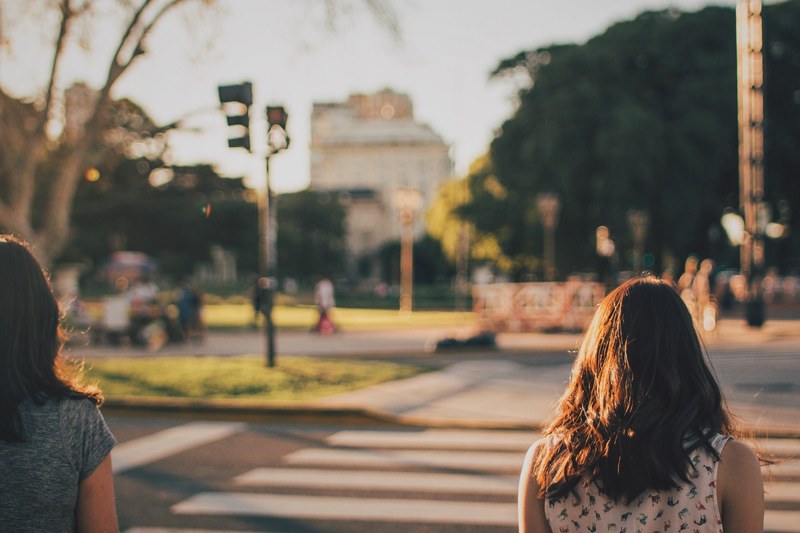 people watching the traffic light waiting to cross the street in buenos aires, people at pedestrian crossing 4k
