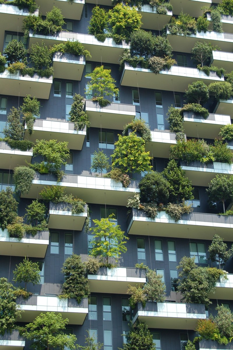 the side of a green apartment building with lots of plants on it, green apartment 4k