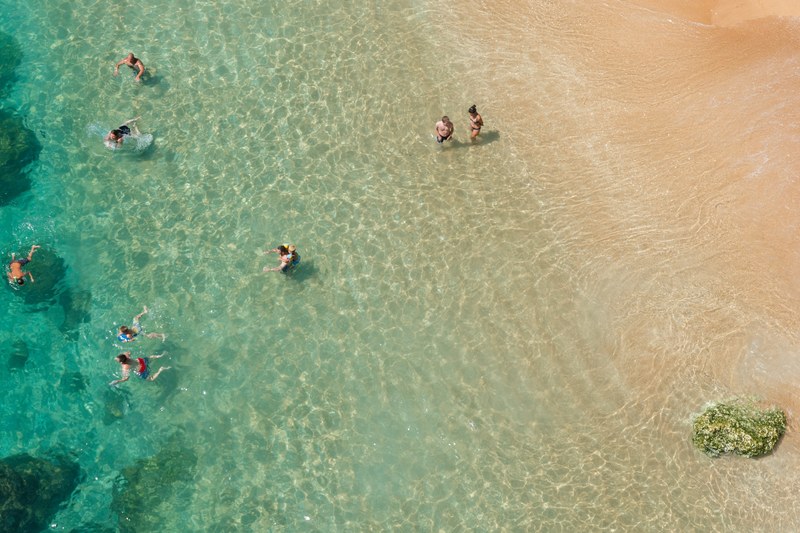 beach people at beach shallow water and swimming 4k