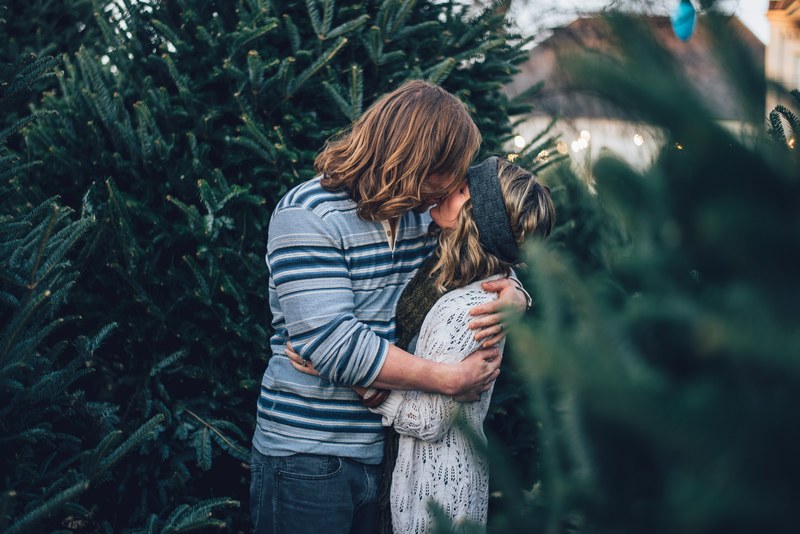 couple kissing among pine trees in nashville, christmas tree lot kiss 4k