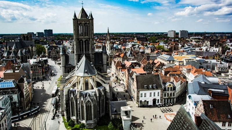 a shot from above the cathedral and architecture in the town of ghent, _cathedral architecture ghent 4k