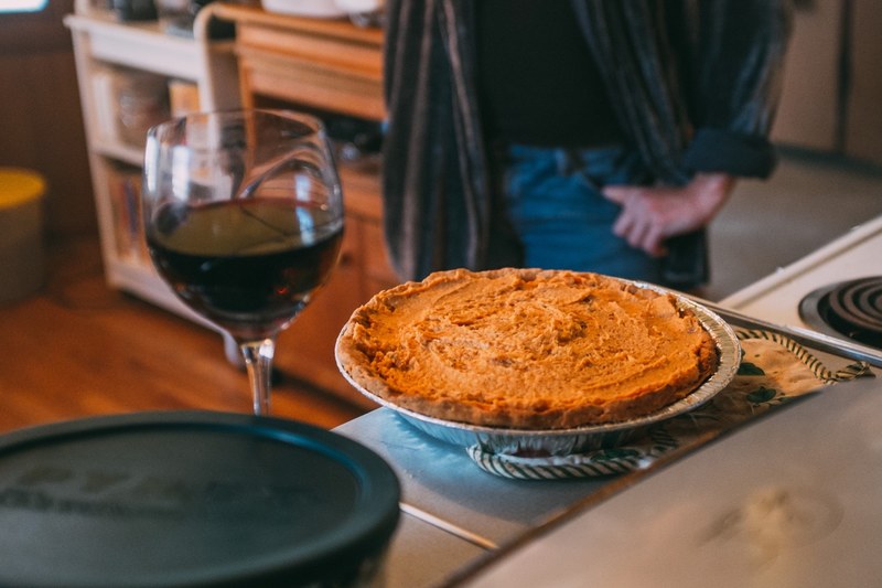 a pie next to a glass of wine, _wine glass pie plate 4k