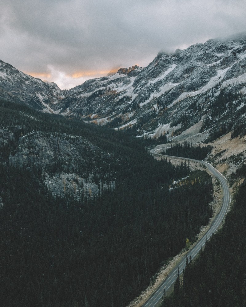 a winding road in the mountains in north cascades national park, winding mountain road 4k