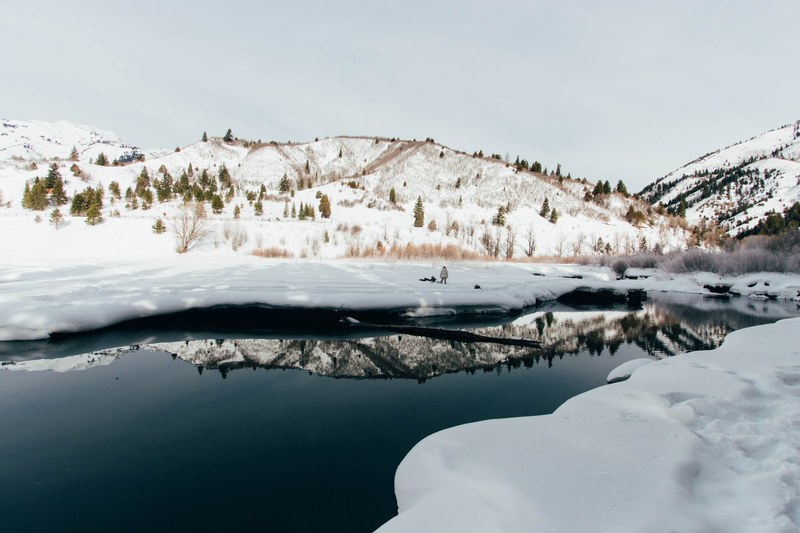 the reflections of a snow covered mountain in a dark lake, snow covered mountain reflection 4k