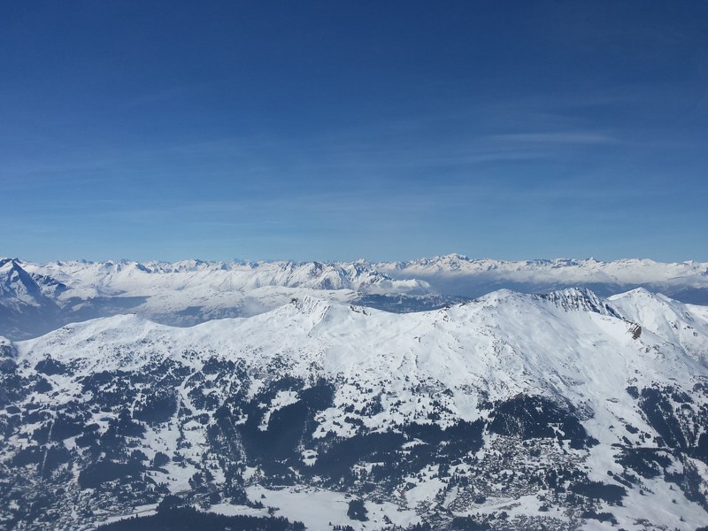 snowy mountaintops with blue sky at parpaner rothom, snowy mountains under blue sky 4k