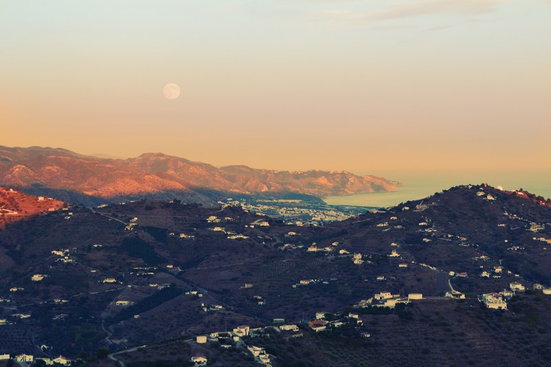 full moon rises over a rural village overlooking the sea, full moon village landcape 4k