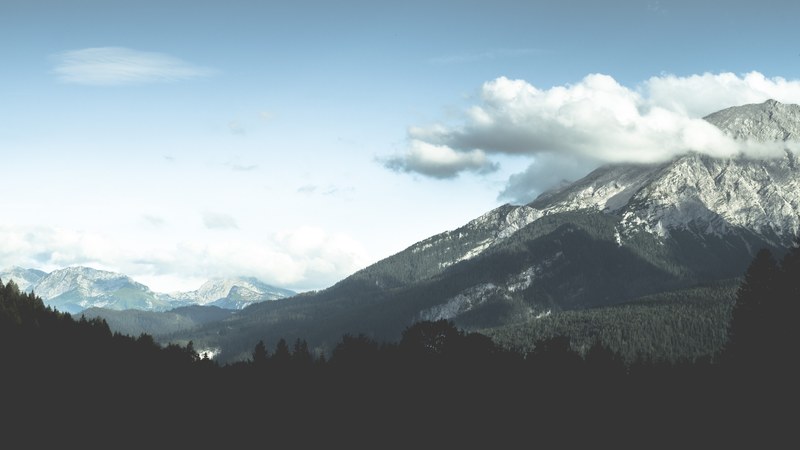clouds over wooded mountains in hintersee, green hintersee slopes 4k