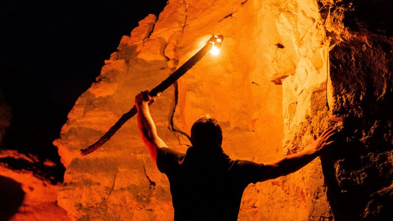 man, silhouette, fire, rocks, 4k