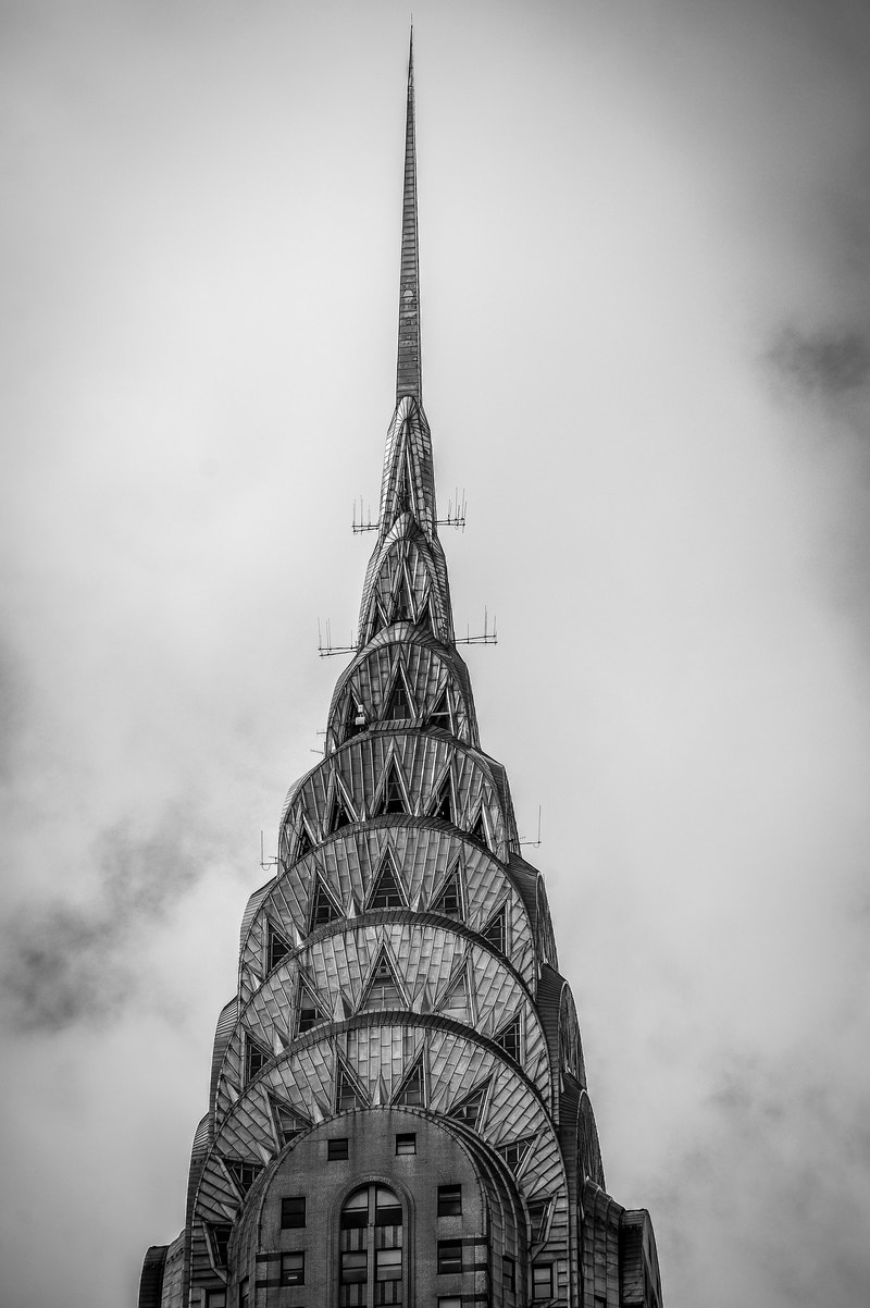 black and white photo of the top of the chrysler building in new york city, new york architecture 4k