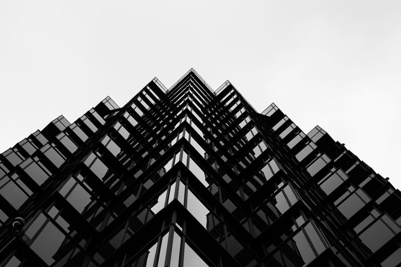 the edges of a wavy skyscraper facade in black and white, jagged lines 4k